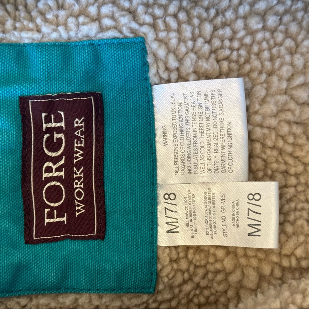 Blue vest, with wool inside.